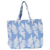 The Fern Jute Tote sits on a white background. The bag design features a white fern print.