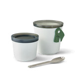 The Lunch Pot on a white background with the two containers separated and sitting next to each other and the spork laying next to them.